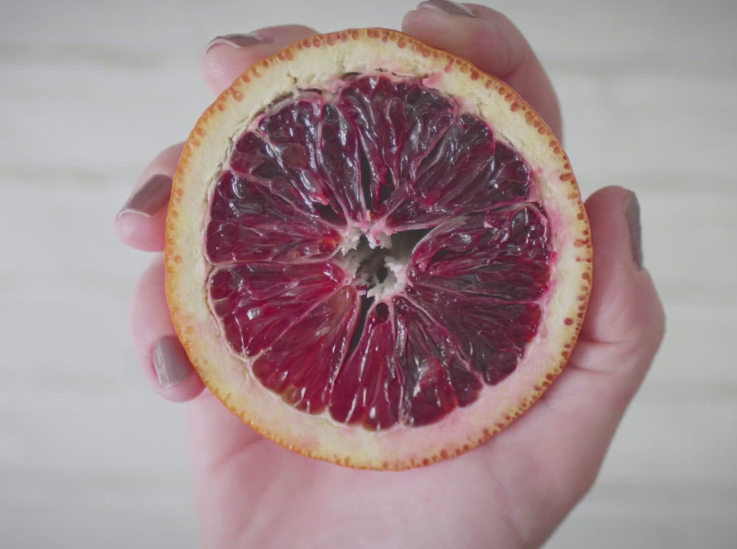 Gif of squeezed blood orange